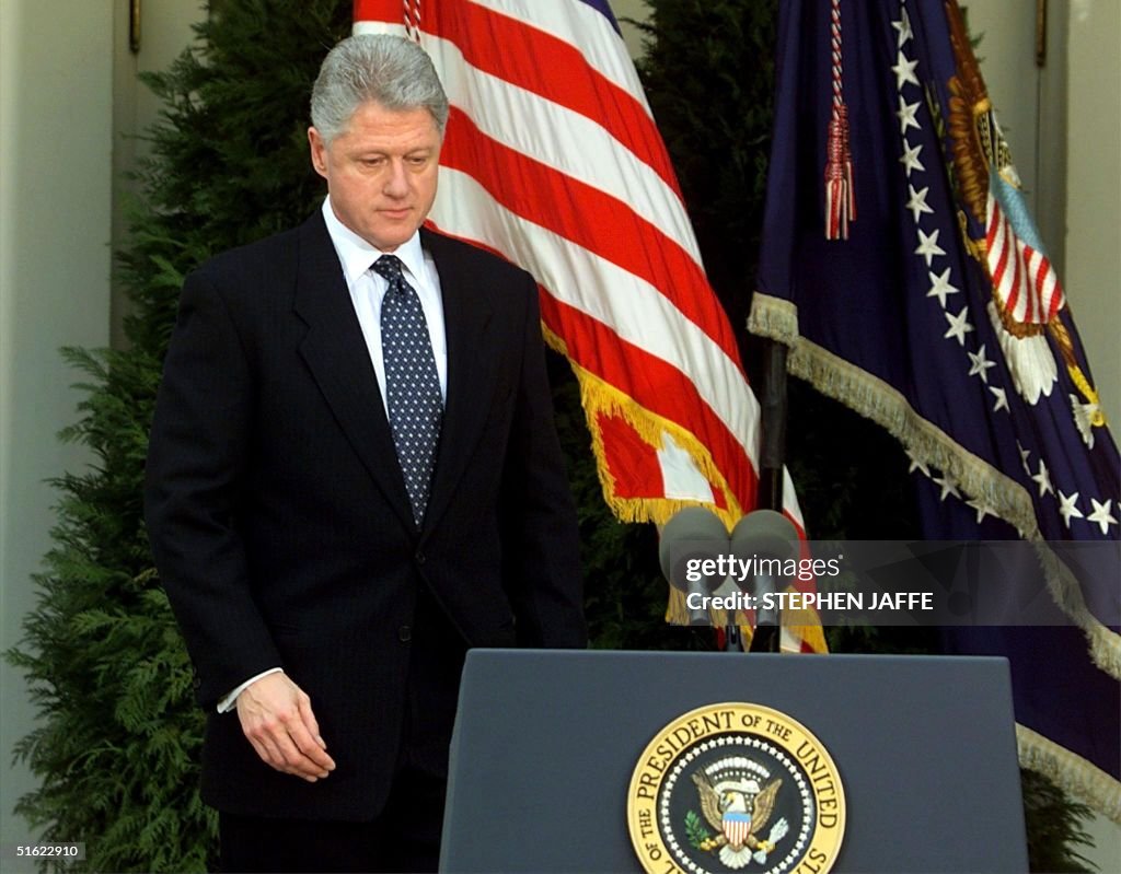 US President Bill Clinton walks to the podium mome