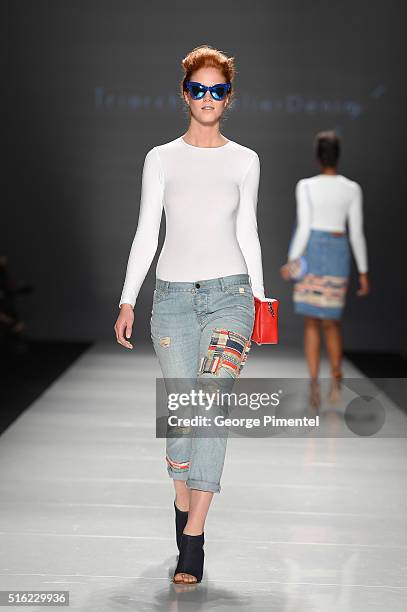 Model walks the runway wearing Triarchy 2016 collection during Toronto Fashion Week Fall 2016 at David Pecaut Square on March 17, 2016 in Toronto,...