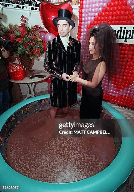David Gakshteyn and Cleo Londono are married on Valentines Day while standing in a pool of melted chocolate at Serendipity Restaurant 14 February in...