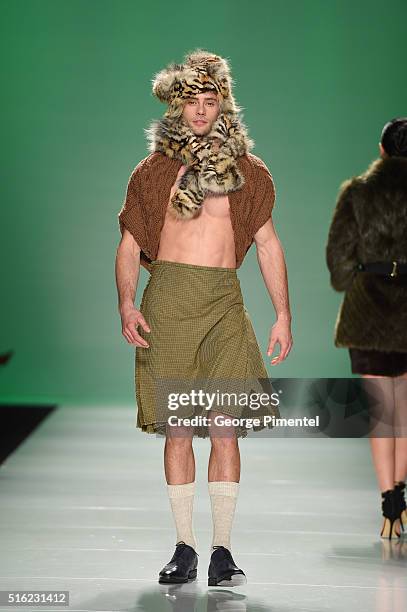 Model walks the runway wearing Farley Chatto 2016 collection during Toronto Fashion Week Fall 2016 at David Pecaut Square on March 17, 2016 in...