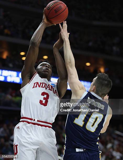 Anunoby of the Indiana Hoosiers shoots against Peyton Woods of the Chattanooga Mocs in the second half during the first round of the 2016 NCAA Men's...
