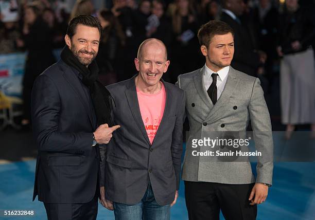 Hugh Jackman, Eddie 'The Eagle' Edwards and Taron Egerton arrive for the European premiere of 'Eddie The Eagle' at Odeon Leicester Square on March...