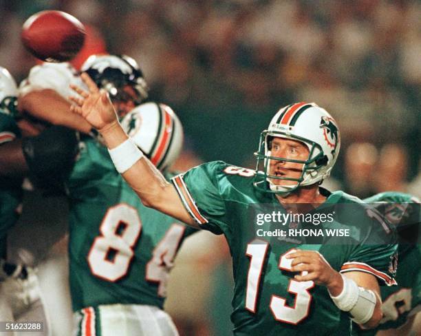 Miami Dolphins quarter back Dan Marino throws a pass during 4th quarter action against the Denver Broncos 21 December at Pro Player Stadium in Miami,...