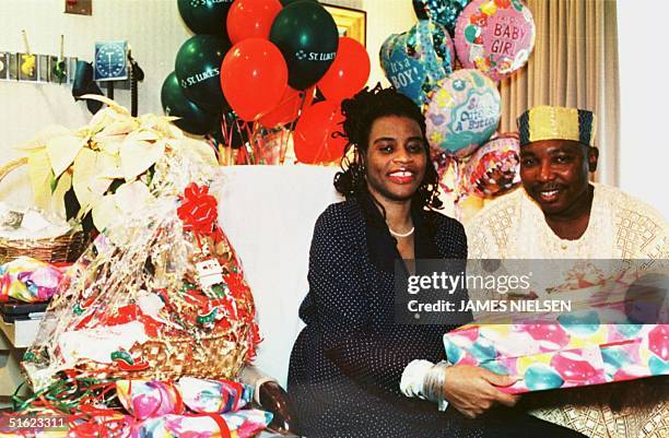 Nkem Chukwu, the mother of the world's only nine octuplets, poses with her husband, Iyke Louis Udobi, in her room at St. Luke's Episcopal Hospital in...