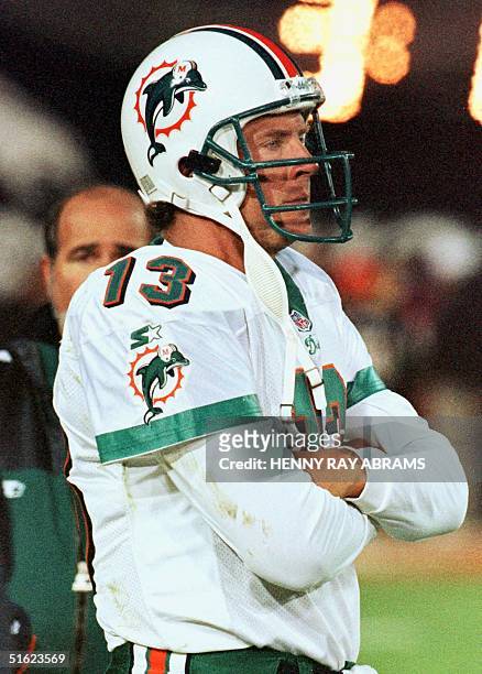 Miami Dolphins quarterback Dan Marino watches time run out on his season late in the fourth quarter of the Dolphins' 38-3 loss to the Denver Broncos...