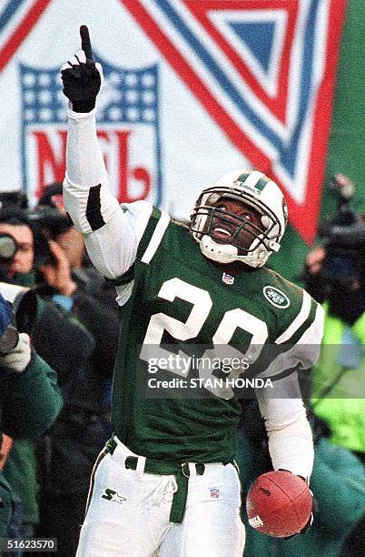 New York Jets running back Curtis Martin celebrates his second touchdown of the game in the third quarter of their 10 January AFC playoff game with...