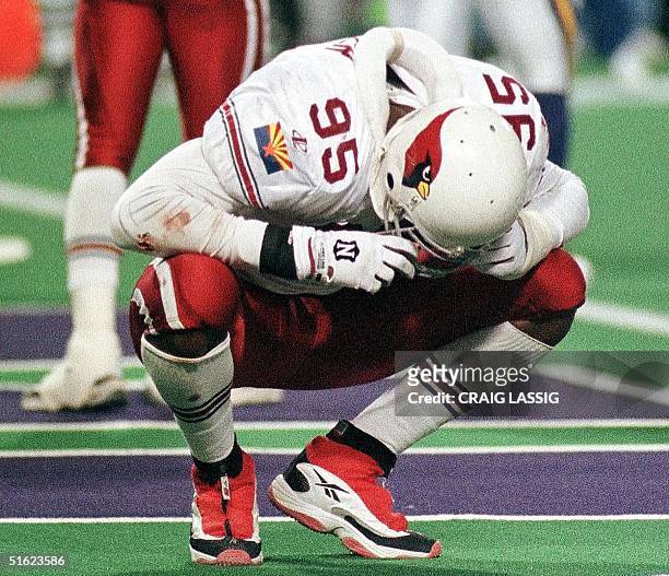 Jamir Miller of the Arizona Cardinals crouches dejected after a Minnesota Vikings touchdown 10 January during their NFC Divisional playoff game at...
