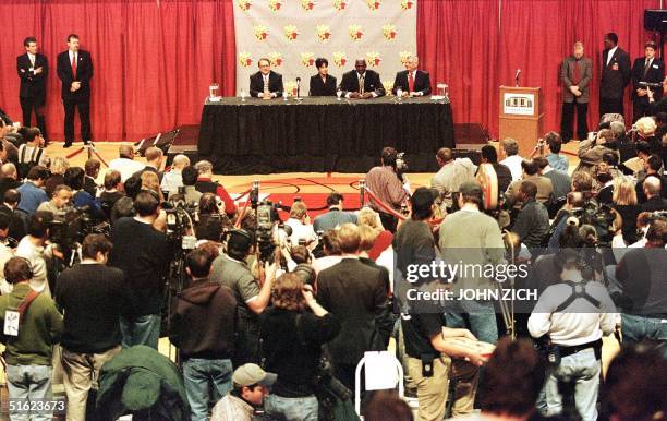 Michael Jordan of the Chicago Bulls sits with his wife Juanita Jerry Reinsdorf , chairman of the Bulls and NBA commissioner David Stern at a press...