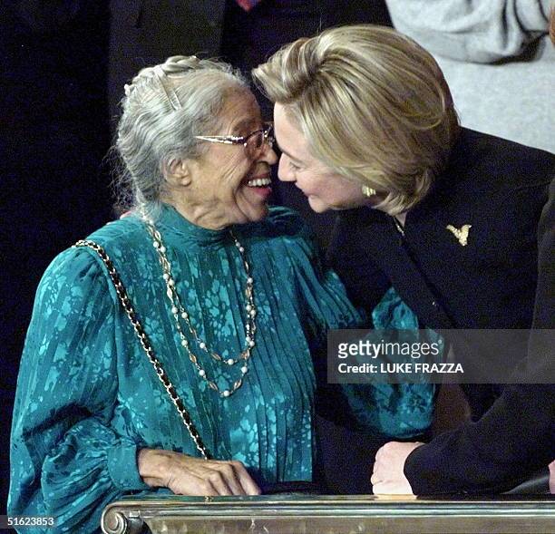 First Lady Hillary Clinton exchanges kisses from Rosa Parks prior to President Bill Clinton's State of the Union address on Capitol Hill 19 January...
