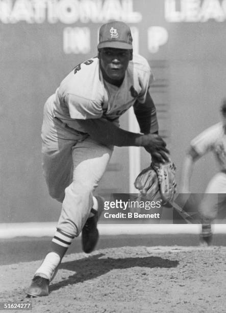 Pitcher Bob Gibson of the St. Louis Cardinals throws a pitch during the 7th inning of Game 7 of the 1967 World Series against the Boston Red Sox on...