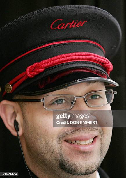 Edwin Fernandez smiles while at his job at Cartier on Fifth Ave. In Manhattan 29 October, 2004. New York's Fifth Avenue and the Champs-Elysees in...