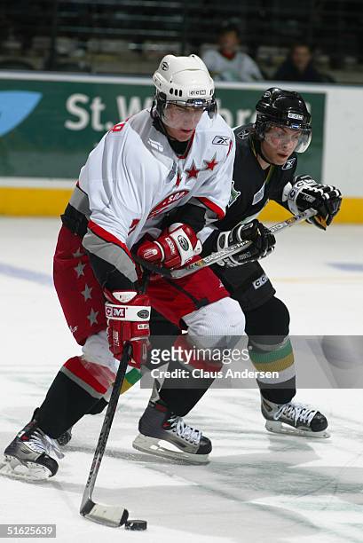 Jeff Carter of the Sault Ste. Marie Greyhounds skates and protects the puck into the offensive zone during a game against London Knights at the John...