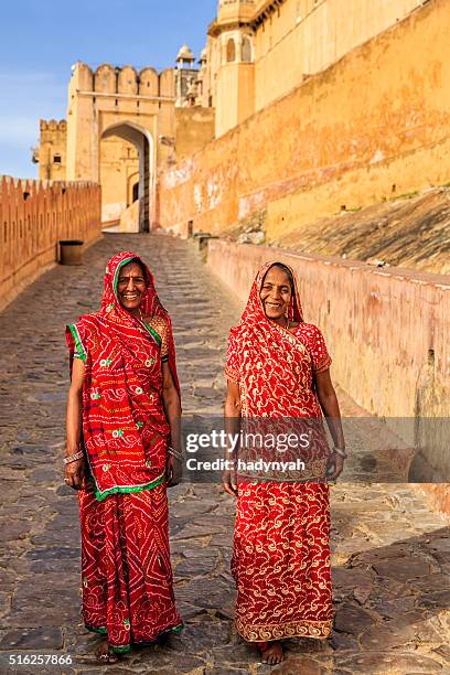 two indian women on the way to amber fort, india - amer fort stock pictures, royalty-free photos & images