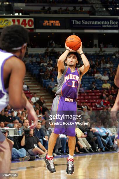 Yuta Tabuse of the Phoenix Suns shoots the ball against the Sacramento Kings during the game on October 29 at Arco Arena in Sacramento, California....