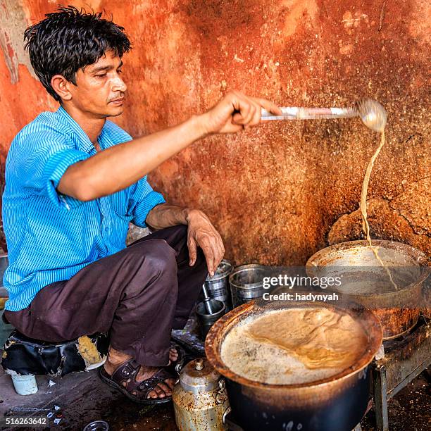 indian street seller selling tea - masala chai in jaipur - chai tea stock pictures, royalty-free photos & images