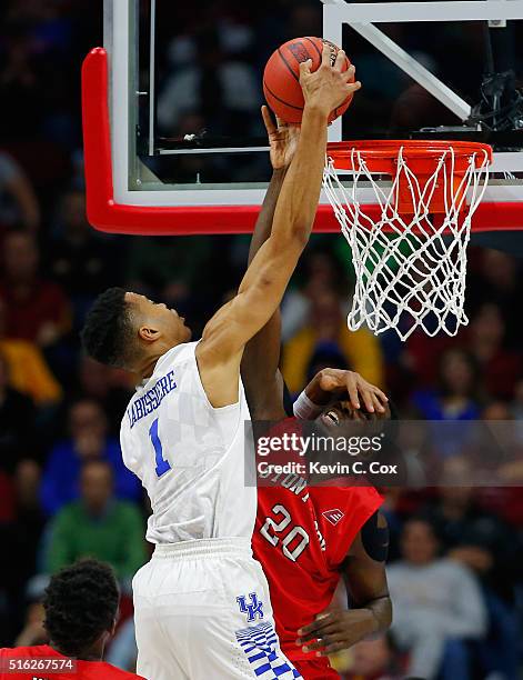 Jameel Warney of the Stony Brook Seawolves blocks a shot by Skal Labissiere of the Kentucky Wildcats in the first half during the first round of the...