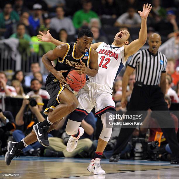 Rashard Kelly of the Wichita State Shockers drives against Ryan Anderson of the Arizona Wildcats during the first round of the 2016 NCAA Men's...
