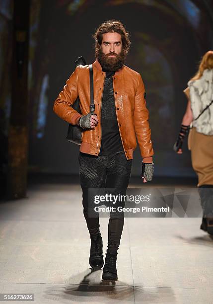 Model walks the runway wearing Rudsak 2016 collection during Toronto Fashion Week Fall 2016 at David Pecaut Square on March 17, 2016 in Toronto,...