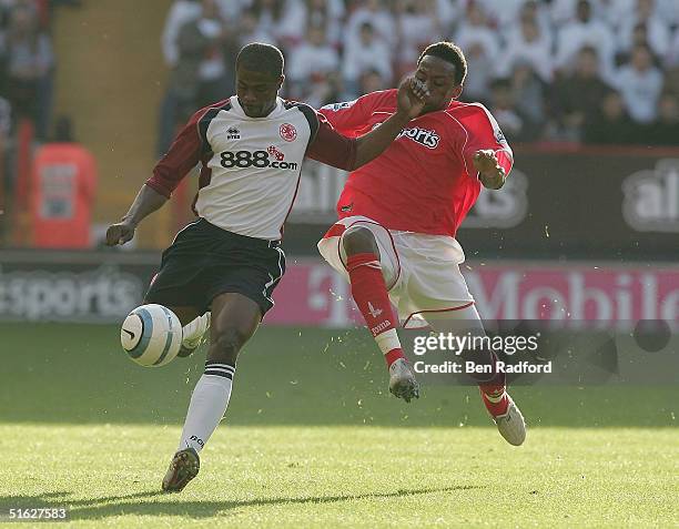 Jason Euell of Charlton Athletic tackles George Boateng of Middlesbrough during the Barclays Premiership match between Charlton Athletic and...