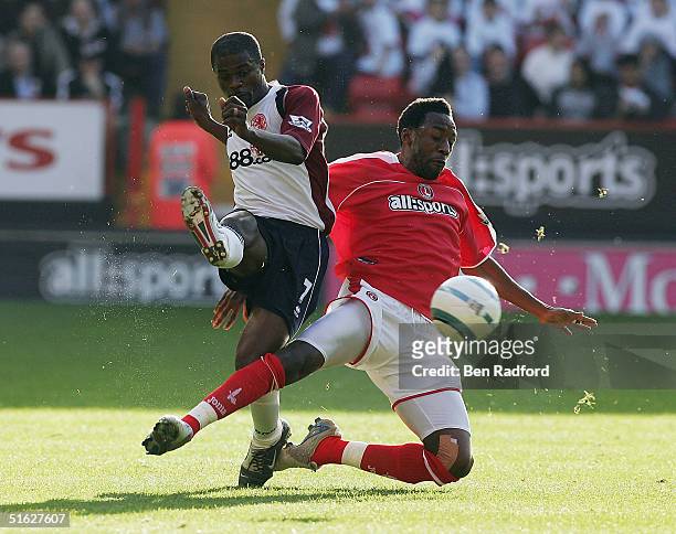 Jason Euell of Charlton Athletic tackles George Boateng of Middlesbrough during the Barclays Premiership match between Charlton Athletic and...