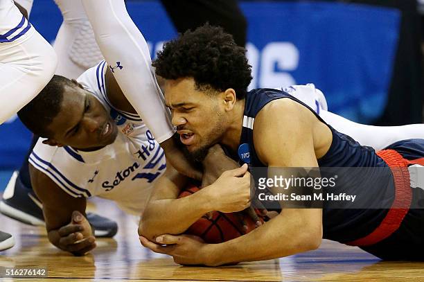 Silas Melson of the Gonzaga Bulldogs and Isaiah Whitehead of the Seton Hall Pirates vie for posession in the first half during the first round of the...