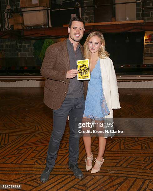 Ben Higgins and Lauren Bushnell from "The Bachelor" pose for photographs after attending "The Lion King" on Broadway at the Minskoff Theatre on March...
