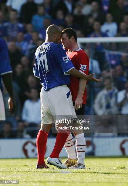 Wayne Rooney of Manchester squares up to Nigel Quashie of Portsmouth during the Barclays Premiership match between Portsmouth and Manchester United...