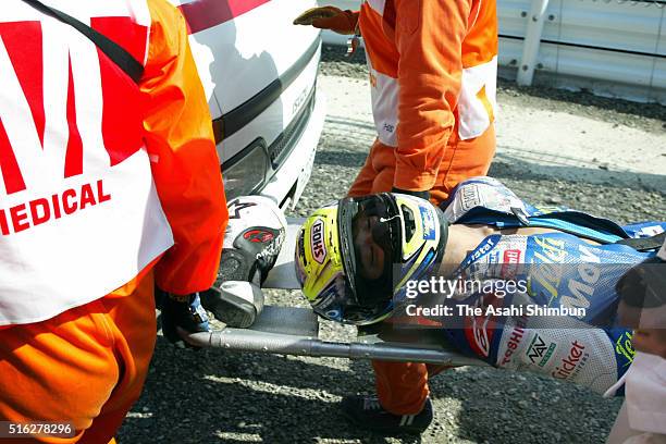 Dajiro Kato of Japan and the Telefonica Moviestar Honda team is carried from the circuit by emergency medical staff after a high speed crash during...