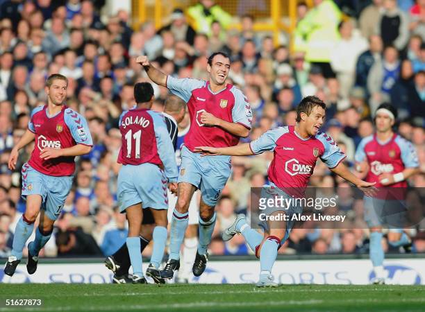 Lee Hendrie of Aston Villa celebrates scoring his goal during the Barclays Premiership match between Everton and Aston Villa at Goodison Park on...