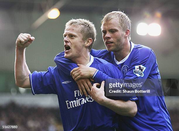 Damien Duff of Chelsea is congratulated by team-mate Eidur Gudjohnsen after scoring during the Barclays Premiership match between West Bromwich...