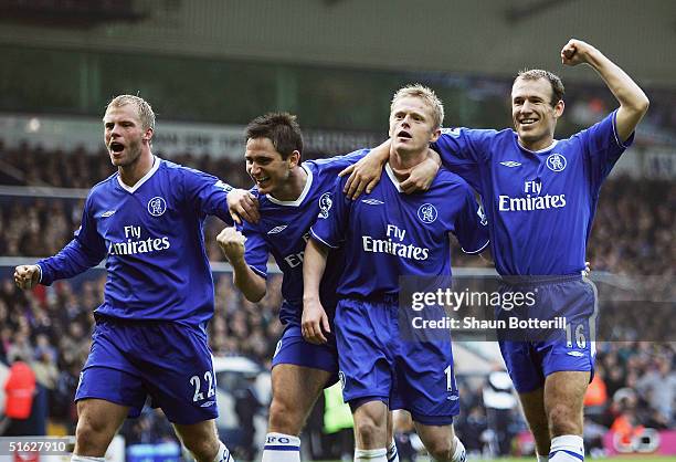 Damien Duff of Chelsea is congratulated by team-mates Eidur Gudjohnsen, Frank Lampard and Arjen Robben after scoring during the Barclays Premiership...