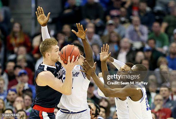 Isaiah Whitehead, Derrick Gordon and Angel Delgado of the Seton Hall Pirates defends against Domantas Sabonis of the Gonzaga Bulldogs in the second...