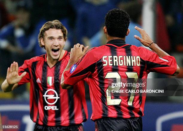 Milan's Ukraine striker Andrij Schev celebrates with teammate Brazilian Serginho after scoring against Sampdoria during their Serie A match at Luigi...