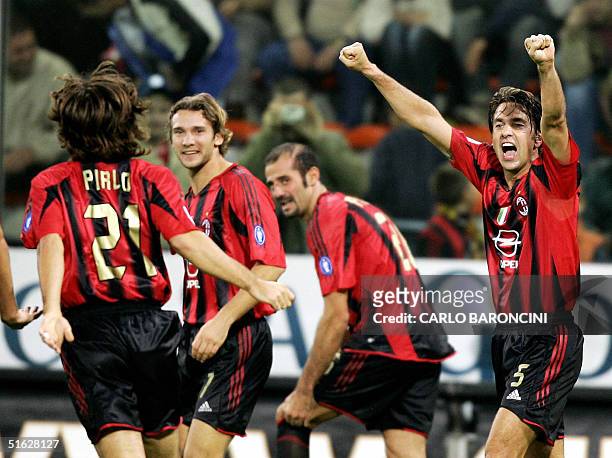 Milan's Ukrainian striker Andrij Schev celebrates with his teammates Alessandro Costacurta and Andrea Pirlo after scoring against Sampdoria during...