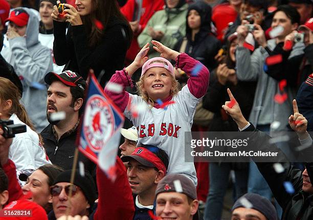 Boston Red Sox fans celebrate during a World Series victory parade October 30, 2004 in Boston, Massachusetts. The Red Sox beat the Cardinals in four...