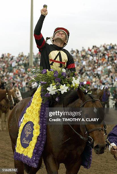 Jockey Javier Castellano on Ghostzapper celebrates as he is walked to the winner's circle after taking the four mllion-dollar Classic Race at the...