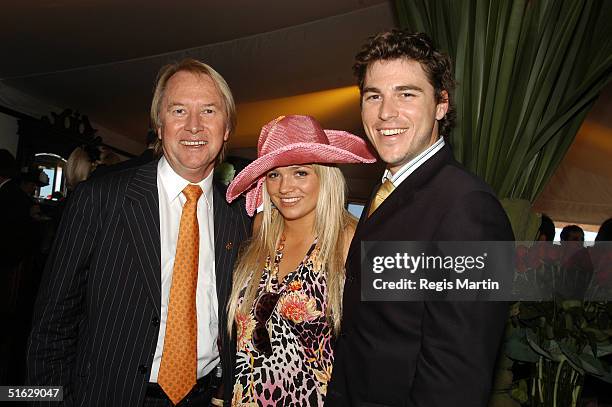 Glenn Wheatley, Stephanie McIntosh and Peter Timbs pose during the AAMI Victoria Derby Day at Flemington Racecourse October 30, 2004 in Melbourne,...