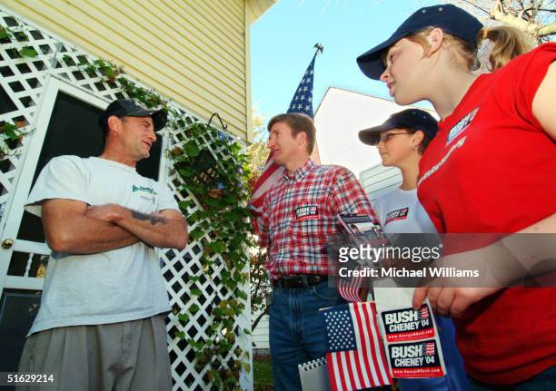 Kevin Hickman discusses the state of the nation and the coming election with Bush campaign volunteers who came to his door on October 30, 2004 in...