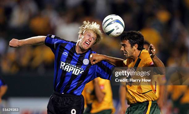 Jovan Kirovski of the Los Angels Galaxy heads the ball as he clashes with Nat Borchers of the Colorado Rapids in the Western Conference Semifinals...