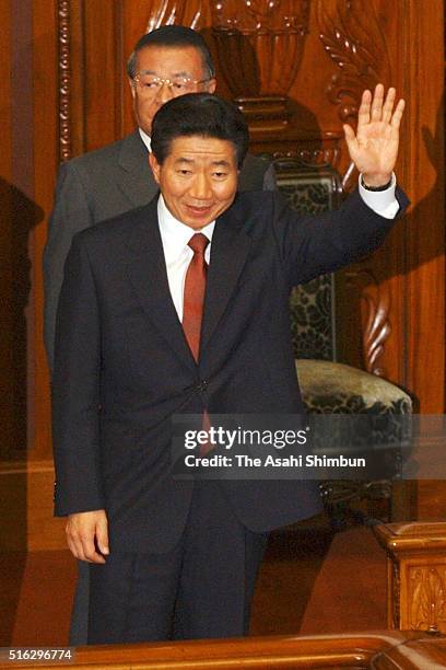 South Korean President Roh Moo Hyun waves prior to address at the lower house plenary session at the diet building on June 9, 2003 in Tokyo, Japan.