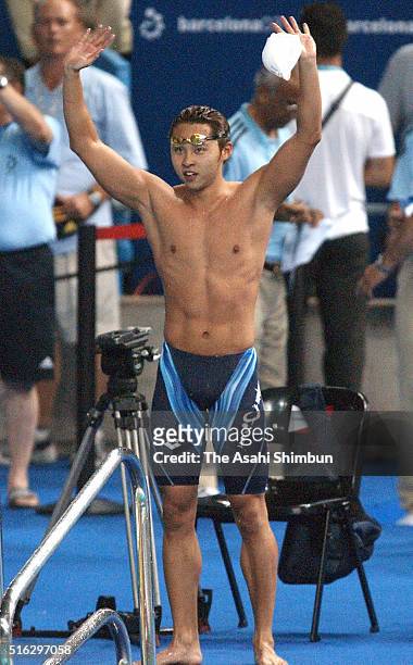 Kosuke Kitajima of Japan celebrates winning the gold with the new World Record in the Men's 100m Breaststroke during day ten of the FINA World...