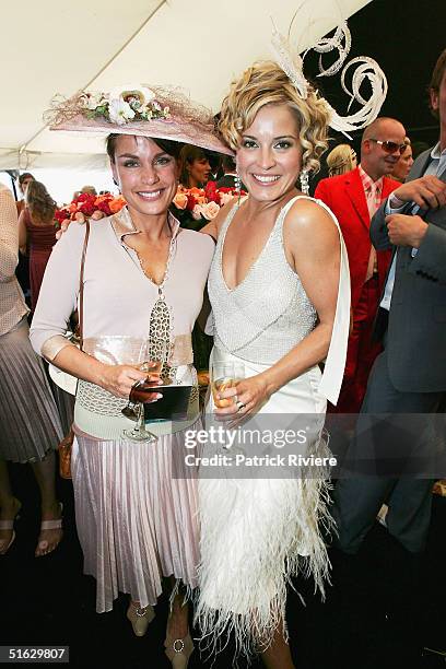 Actresses Alexandra Davies and Sigrid Thornton attend the Melbourne Cup Carnival's Derby Day in the Moet et Chandon marquee at Flemington October 30,...