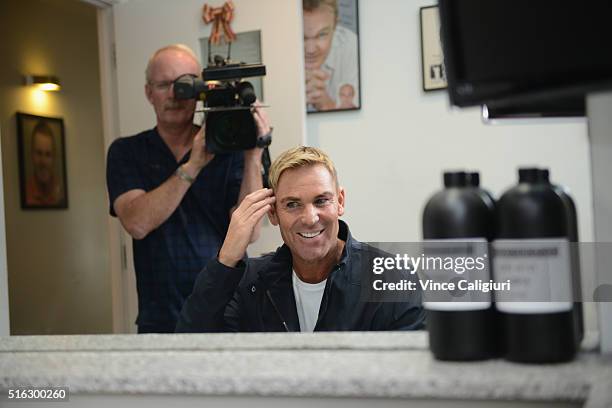 Shane Warne poses with his new hair look during a media opportunity at Advanced Hair Studio on March 18, 2016 in Melbourne, Australia. Shane Warne...