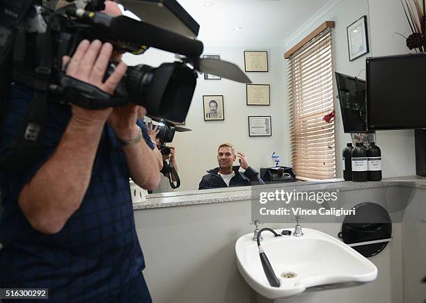 Shane Warne poses with his new hair look during a media opportunity at Advanced Hair Studio on March 18, 2016 in Melbourne, Australia. Shane Warne...