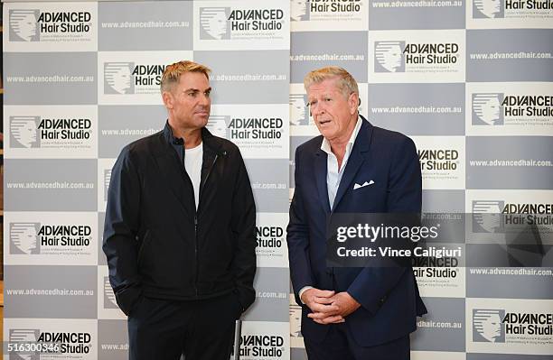 Carl Howell Chairman, Advanced Hair Studio and Shane Warne speak to the media during a media opportunity at Advanced Hair Studio on March 18, 2016 in...