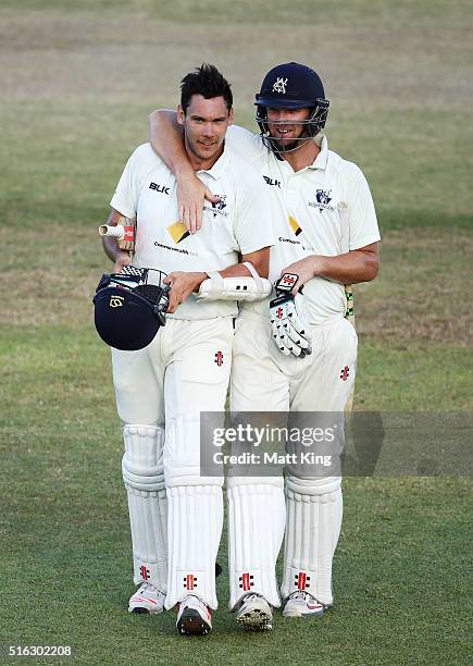 Scott Boland and Cameron White of the Bushrangers celebrate after holding on for a draw during day four of the Sheffield Shield match between...