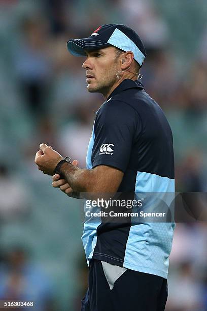 Waratahs defence and skills coach Nathan Grey watches players warm up during the Super Rugby match between the New South Wales Waratahs and the...