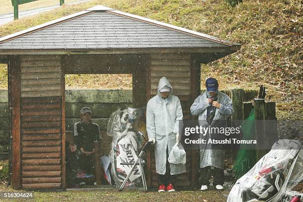 Players are shelter from course as very heavy rain storm move in to suspend play during the first round of the T-Point Ladies Golf Tournament at the...
