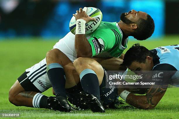 Ryan Tongia of the Highlanders is tackled during the Super Rugby match between the New South Wales Waratahs and the Highlanders at Allianz Stadium on...