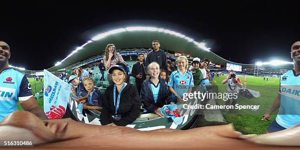 Kurtley Beale of the Waratahs poses with fans following the Super Rugby match between the New South Wales Waratahs and the Highlanders at Allianz...